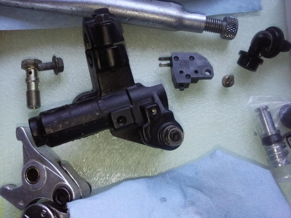 How difficult is it to repair a master cylinder on a Suzuki motorcycle